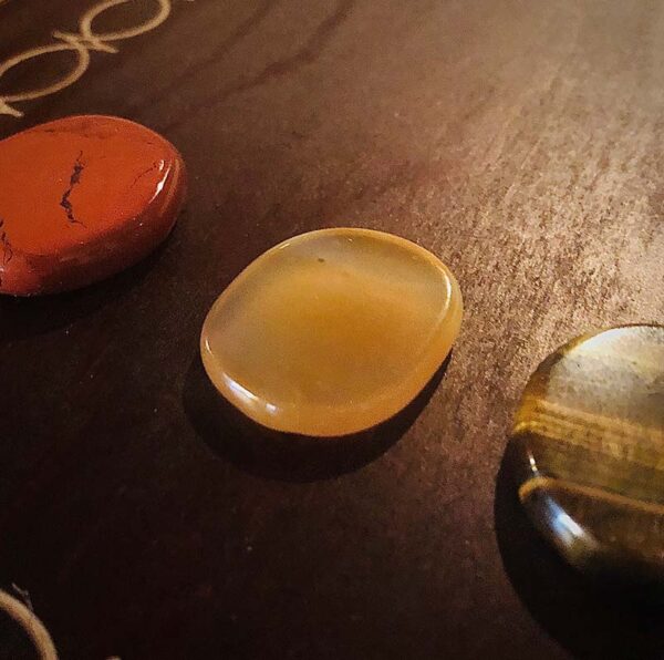 These are the seven chakra healing gem stones and crystal we used in the immersive chakra alignment therapy group class "The 49 Professions of Joy" by personal trainer Jack Kirven. This one is carnelian.