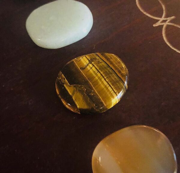 These are the seven chakra healing gem stones and crystal we used in the immersive chakra alignment therapy group class "The 49 Professions of Joy" by personal trainer Jack Kirven. This one is tiger eye.