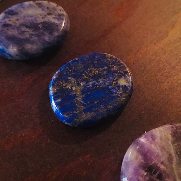 These are the seven chakra healing gem stones and crystal we used in the immersive chakra alignment therapy group class "The 49 Professions of Joy" by personal trainer Jack Kirven. This one is lapis lazuli.