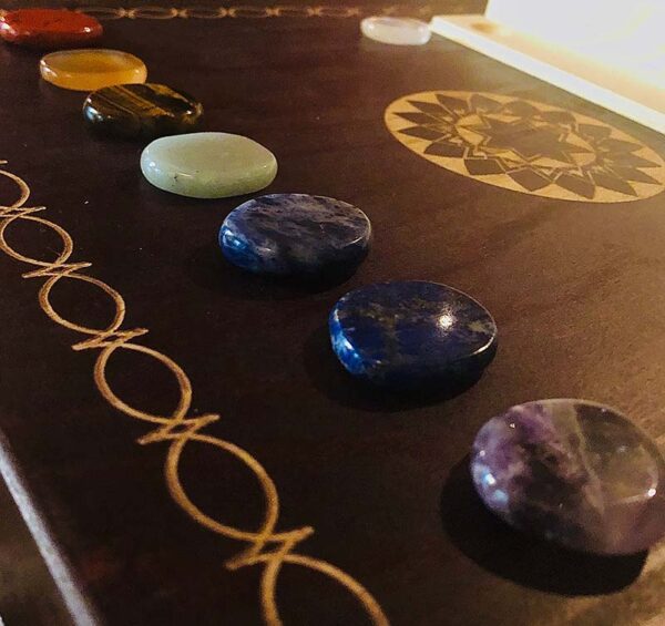These are the seven chakra healing gem stones and crystal we used in the immersive chakra alignment therapy group class "The 49 Professions of Joy" by personal trainer Jack Kirven
